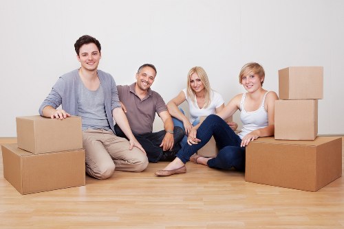 Professional movers handling office furniture during a relocation